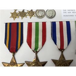 Representative display of WWII Campaign Stars and Medals comprising Burma Star, Italy Star, France & Germany Star, Defence Medal and War Medal 1939-1945; together with the corresponding group of miniatures; all with ribbons