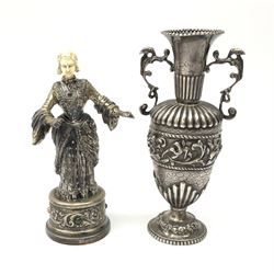 Early 20th Century white metal and ivory figure of a lady, stamped 'A835' together with a small twin handled metal urn with raised bird decoration