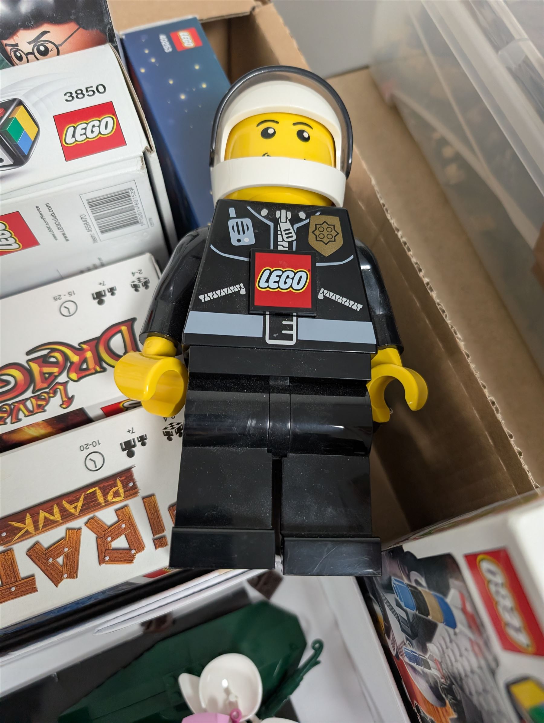 Lego, including partially built Lego Botanicals Orchid, minifigure torch light, five Lego Games including Harry Potter Hogwarts game, Lava Dragon, Pirate Plank, UFO Attack and Meteor Strike 