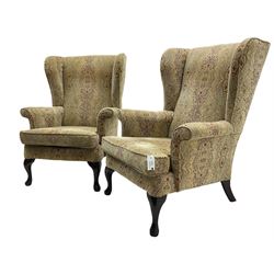 Parker Knoll - 'Burghley' pair of wingback armchairs, upholstered in 'Baslow Medallion' gold floral pattern fabric