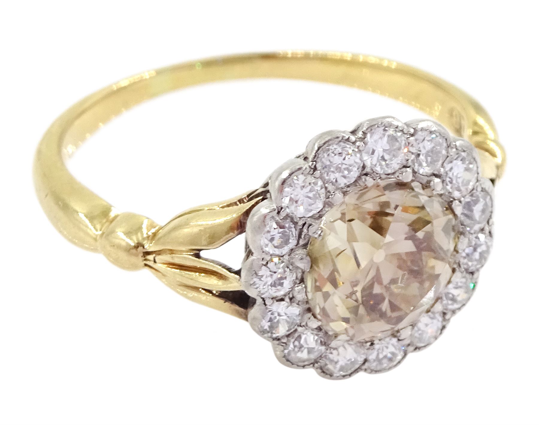 Early 20th century 18ct gold old cut diamond cluster ring, the central fancy light brown diamond of approx 1.60 carat, with a milgrain set white diamond surround of approx 0.45 carat, with Guest & Philips insurance valuation