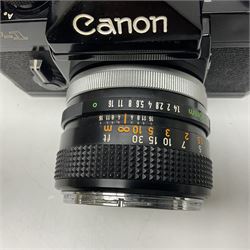 Canon F1n camera body, serial no. 572972, with 'Canon FD 50mm 1:1.4' lens, serial no. 246665, with leather case 