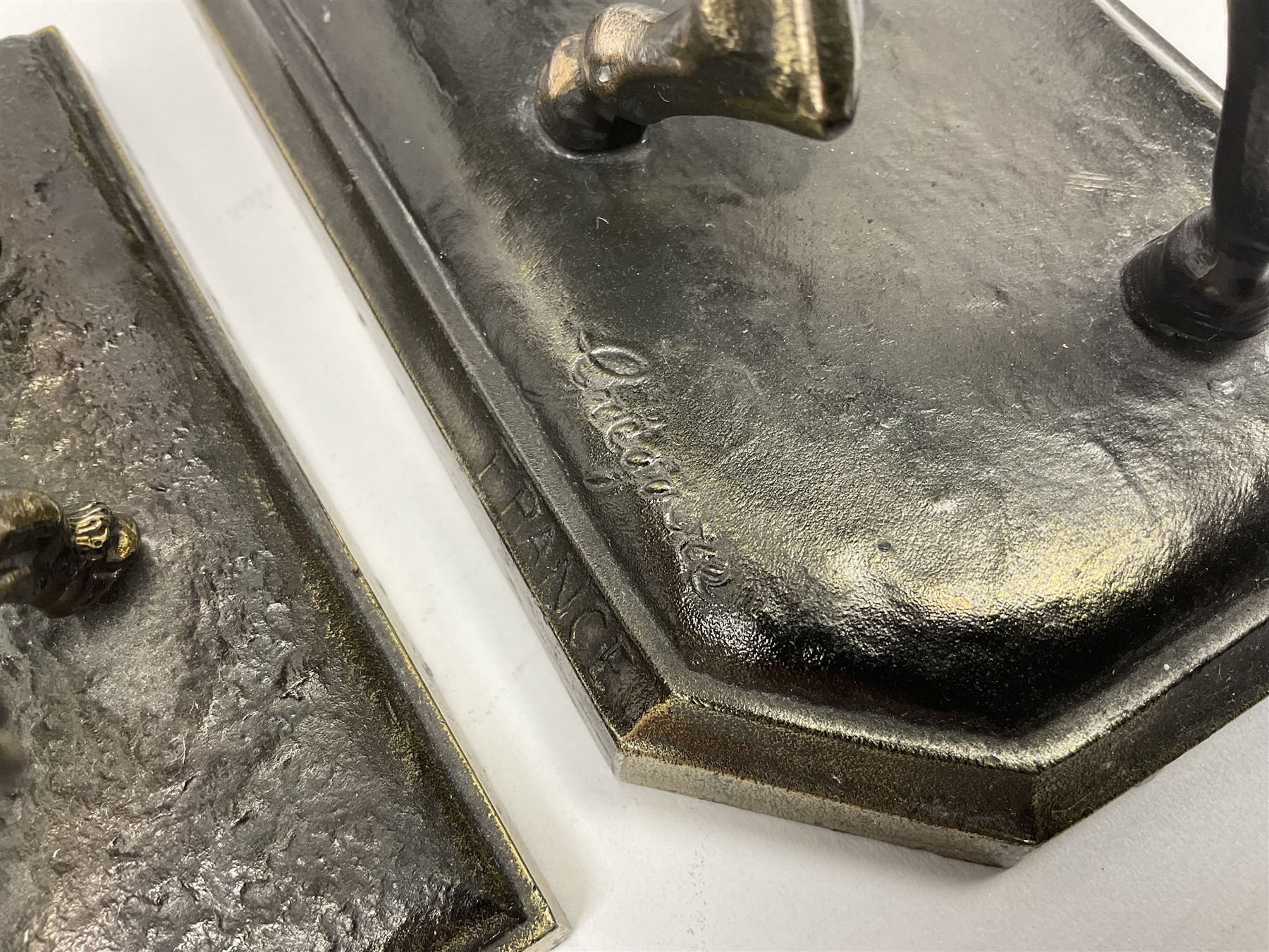 Two figures of Napoleon on horseback, one example standing on octagonal bases marked 'G R France' indistinctly signed, the other on a rectangular base, H19cm 