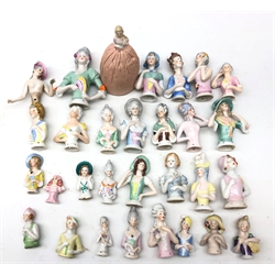  Collection thirty of ceramic pin cushion/ half dolls of varying sizes, including one with pin cushion base, H11cm max   