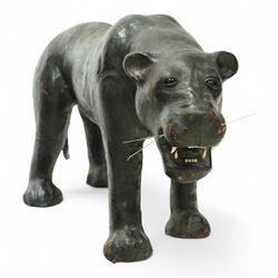 Early 20th century leather-covered decorative model of a Panther in a naturalistic stance, prowling forward with arched back, lowered head, and extended tail, open jaws revealing teeth and fangs with nylon whiskers
