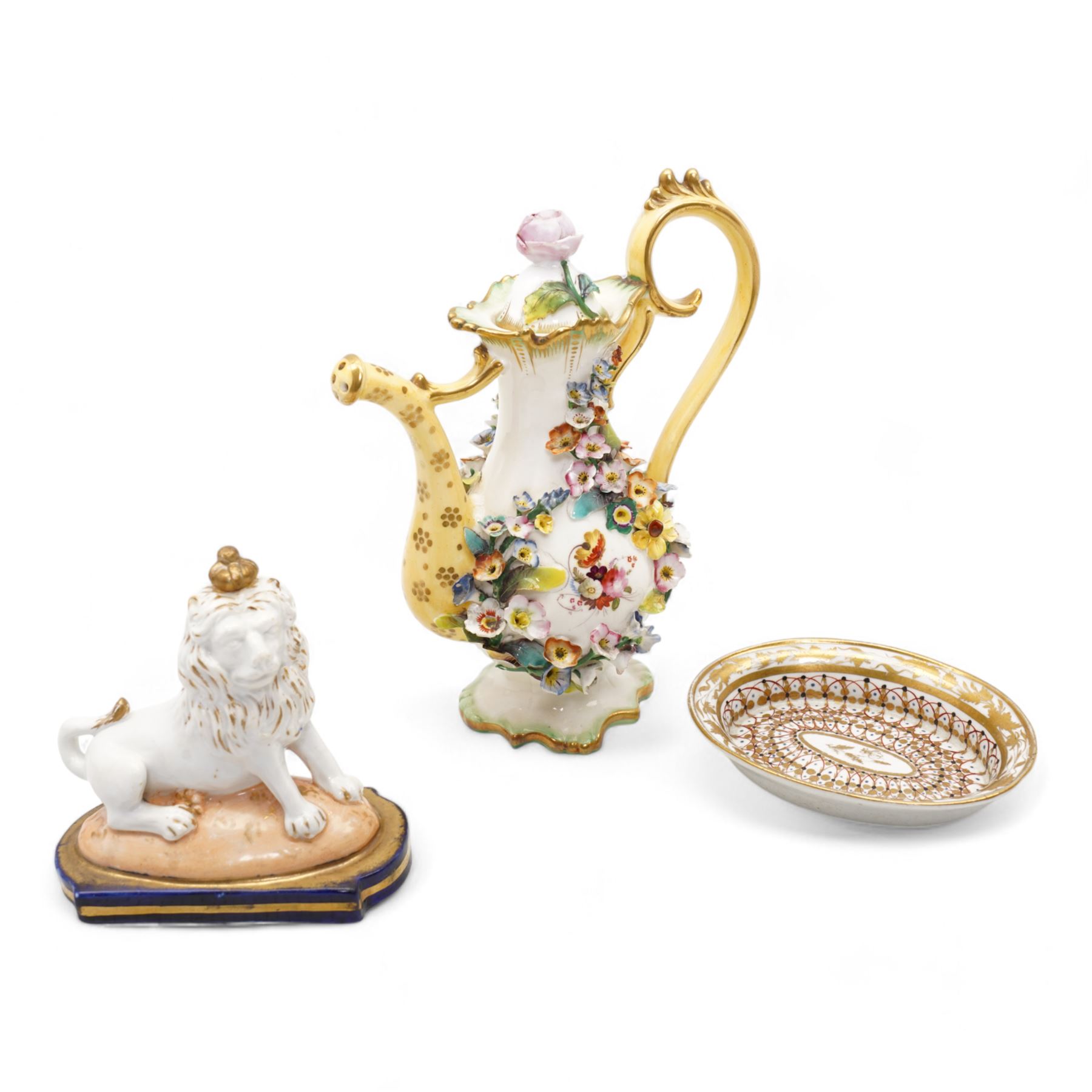 Early 19th century English porcelain miniature rosewater sprinkler in the form of a coffee pot, floral encrusted and painted body with flower knop handle and scroll handle, pattern no. 7916, H16.5cm, 19th century Rockingham style seated model of a Lion, L9.5cm and an early 19th century oval dish, inscribed beneath Geo. Maddey, 1803 (3)