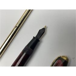 Three fountain pens, to include Conway Stewart 'Dinkie 550' and 'Conway 57' and a Parker 'Slimfold', all with 14ct gold nibs, together two roller ball pens, including a Parker example and a Swarovski Crystal paperweight