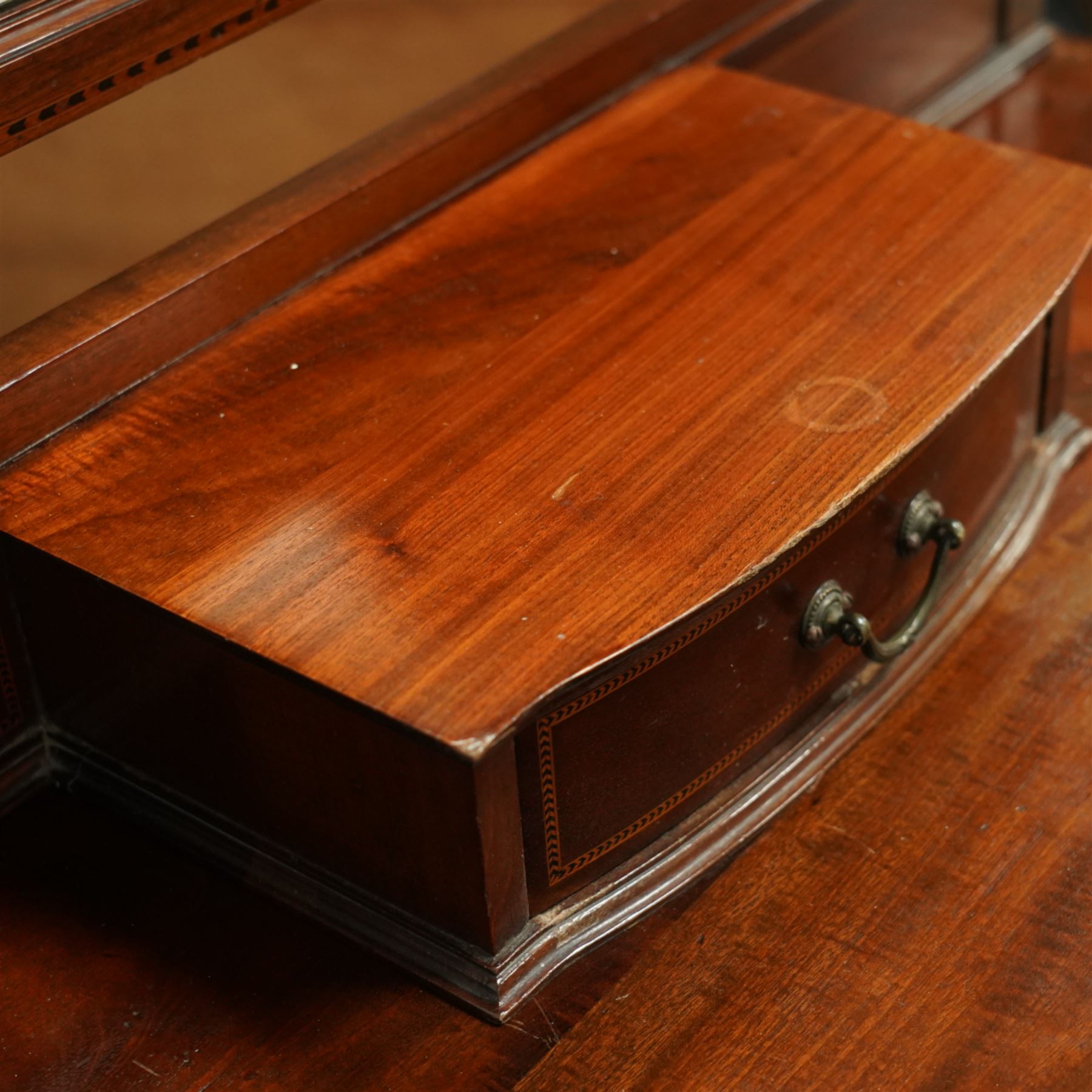 Edwardian mahogany herring-bone inlaid dressing chest, with swivel bevelled dressing mirror, supports with finials, and trinket drawer above chest with three graduated drawers on bracket feet