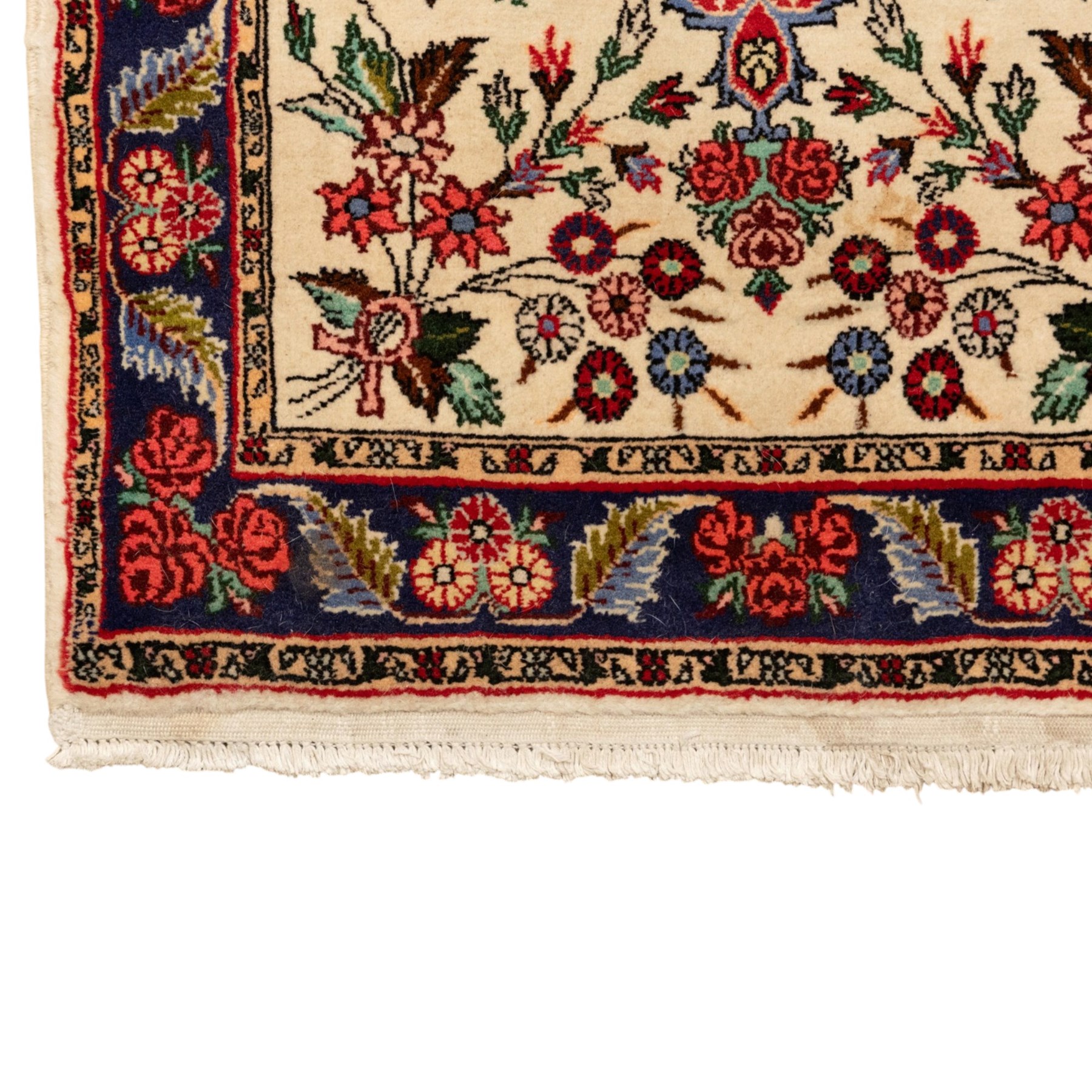 Two small rugs, an ivory ground example decorated with a central floral medallion and scattered rose sprays, enclosed by a navy foliate border (62cm x 101cm), and a crimson pictorial mat worked with seated figures, an animal and birds amongst flowering plants (45cm x 79cm) (2)