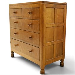 Mouseman - early-to-mid 20th century adzed and panelled oak chest, raised back over rectangular adzed top with canted corners, fitted with two short over three long drawers with turned knob handles, raised on octagonal feet, with carved mouse signature, by the workshop of Robert Thompson of Kilburn