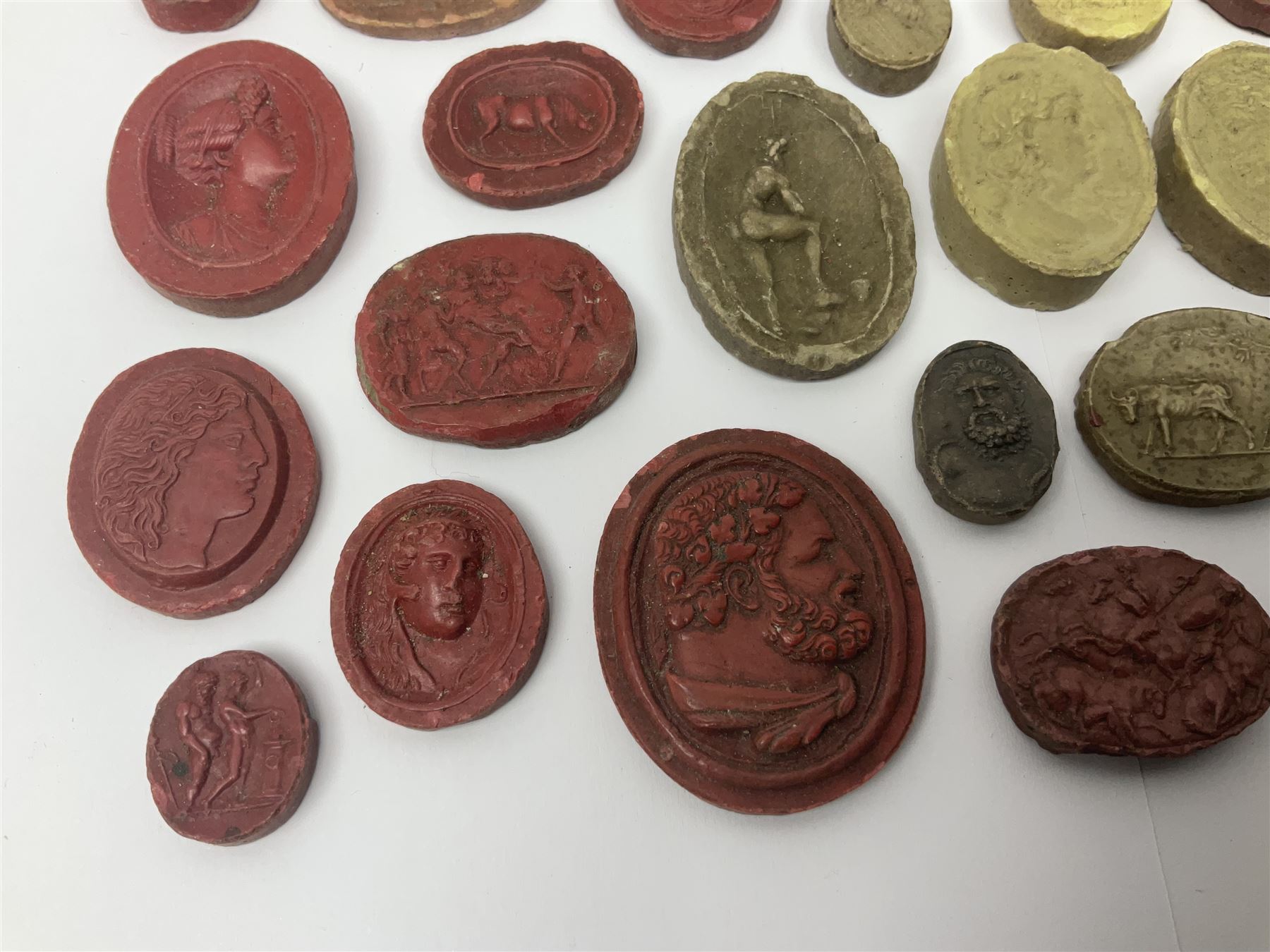 Large and impressive collection of Grand Tour cameos and intaglios (impronte), mostly red plaster examples