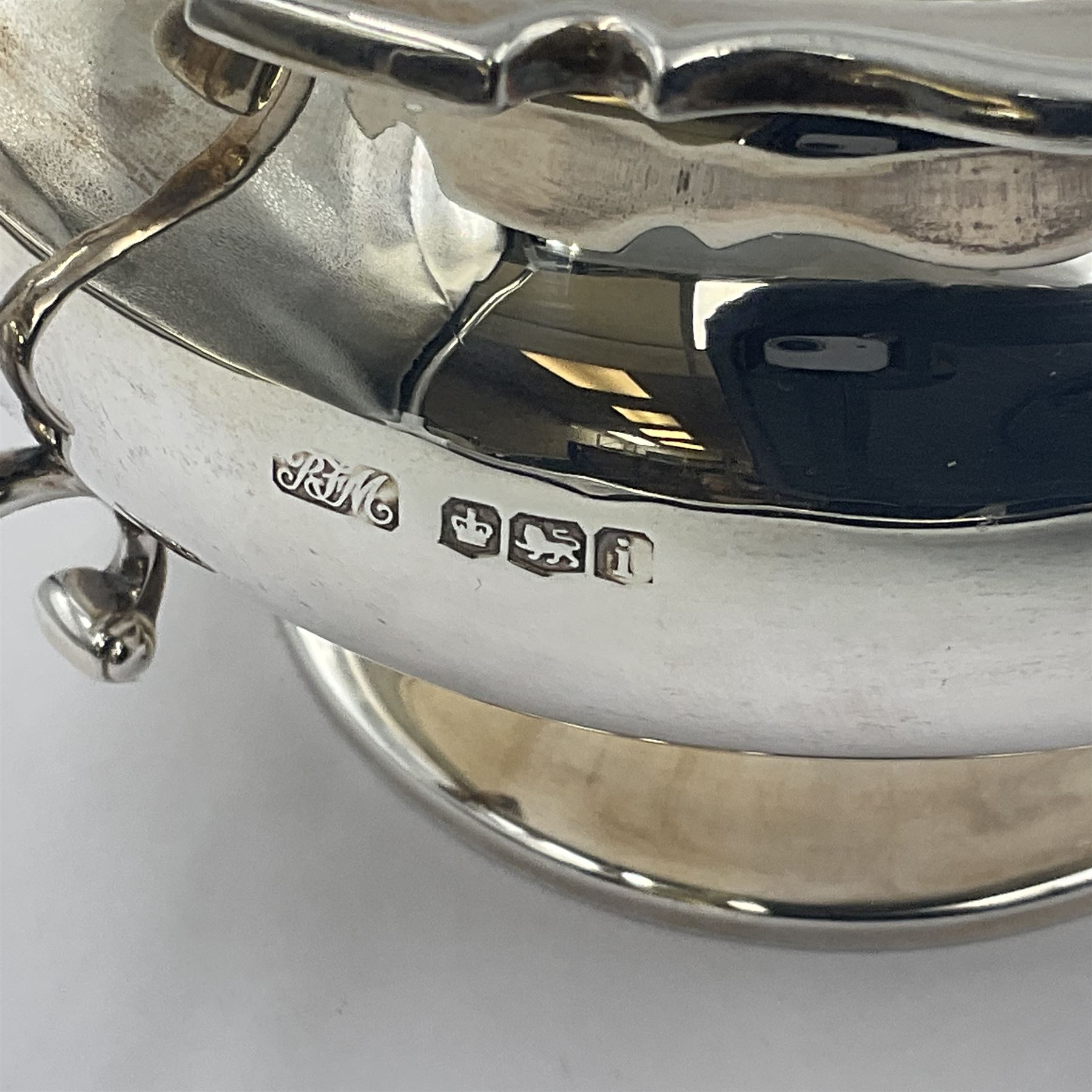 1920s five-piece silver tea service, comprising teapot, coffee pot, hot water pot, twin handled open sucrier and milk jug, each of squat circular form with shaped rim, the teapot, coffee pot and hot water pot each with ebonised handle and finial, the sucrier and milk jug with acanthus capped scroll handles, all upon circular foot, hallmarked R F Mosley & Co, Sheffield 1926 & 1927, tallest H24cm