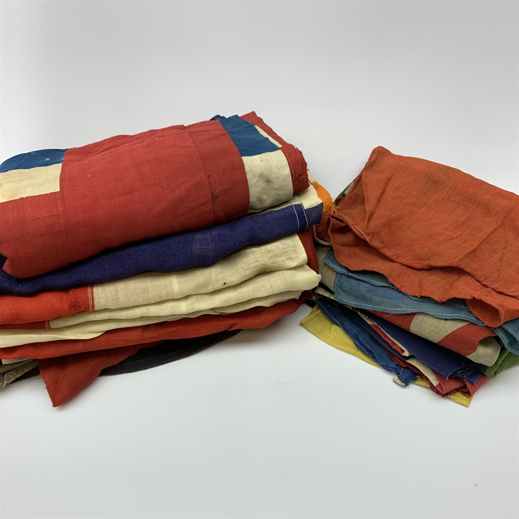 Thirty-seven various flags, pennants etc including Union flags, blue ensign, white ensign, Royal Standard, Scottish Rampant, Wales, Old Canada red ensign, Australia and New Zealand, France, Germany, South Africa (1928-94), semaphore and signal flags, 'God Save The King' banner, bunting flags etc