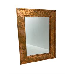 Large copper framed mirror, rectangular bevelled plate, the wide stepped frame with an iridescent finish