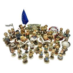 Thirty Hummel figures by Goebel, to include Saluting the Peacekeepers of Operation Joint Endeavor, on wooden plinth, Call to Glory, Celebrate with Song and Soldier Boy