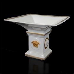 Rosenthal Versace Gorgona pedestal dish, of square form, decorated in relief with Medusa masks and with gilt Greek key borders to the rim and base, boxed, H15cm