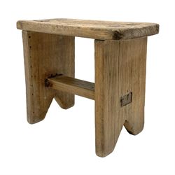 19th century vernacular elm plank stool, rectangular top on end supports joined by flat stretcher