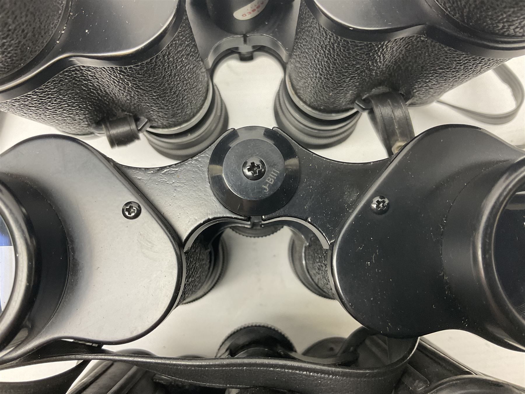 Eleven pairs of binoculars to include Lieberman & Gortz 20x65, Stem (USSR) 7x50, Helios 10x50 Field, Prinz 12x50, Tasco 8x40, Tasco 10x50, etc