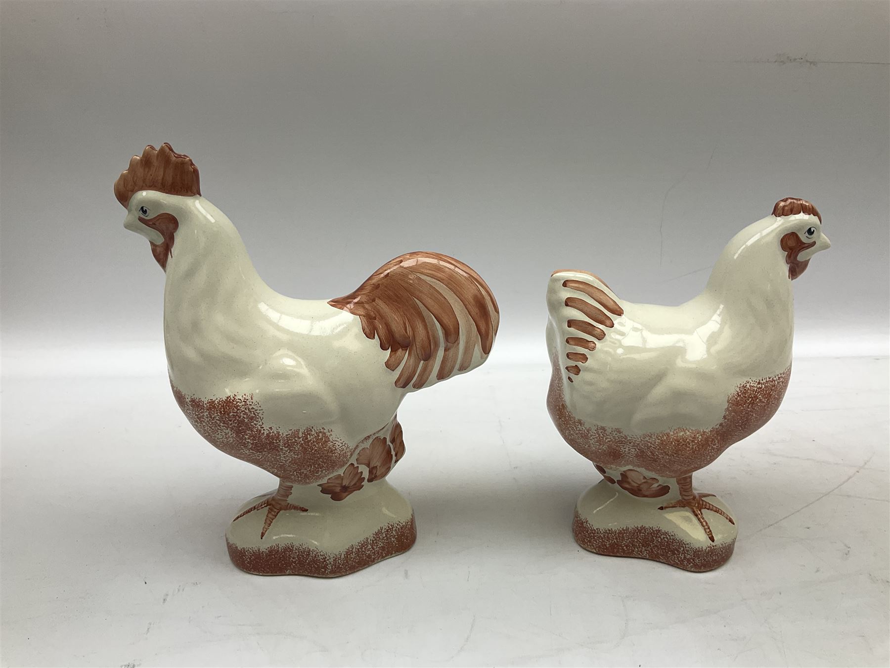 Six Rye Pottery figures, comprising, jumping fox, squirrel upon a branch, billy goat, bull, chicken and cockerel  