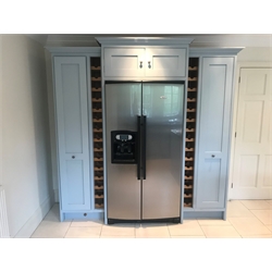  Hovingham Interiors - hardwood framed painted kitchen larder unit, comprising two full height pull out wire basket storage drawers, twin oak wine racks, centre opening suitable for side by side fridge freezer with double cupboard above, W227cm, H222cm, D71cm  
