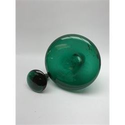 19th century green glass ships decanter with flat topped stopper, H21.5cm, together with a set of four 19th century green glass wine glasses, the funnel bowls upon bladed knopped stems and circular feet, H13cm