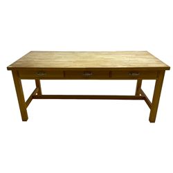 Large beech kitchen table, rectangular top over three drawers, on square supports joined by stretchers
