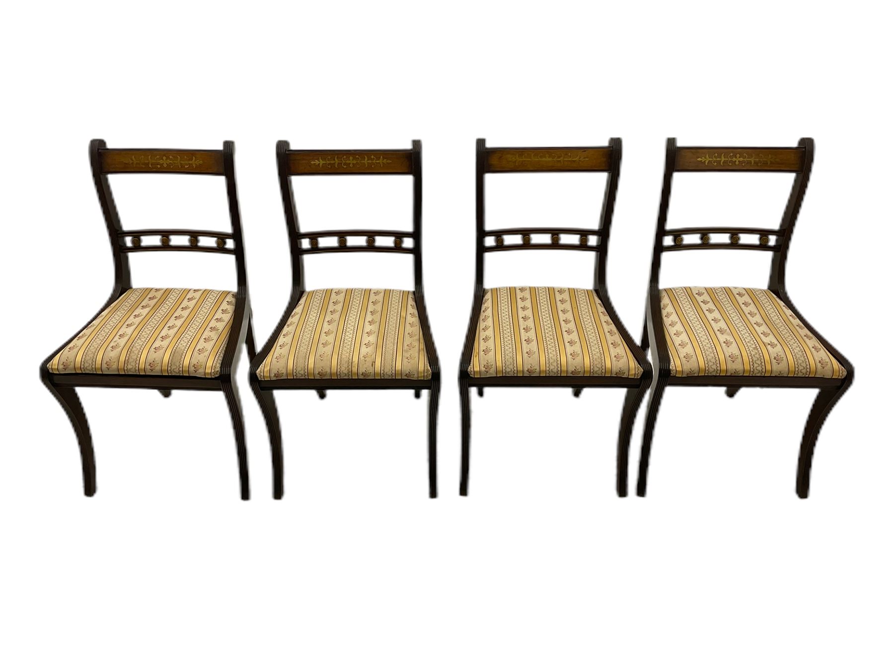 Set of eight Regency style mahogany dining chairs, brass inlay with gilded detail