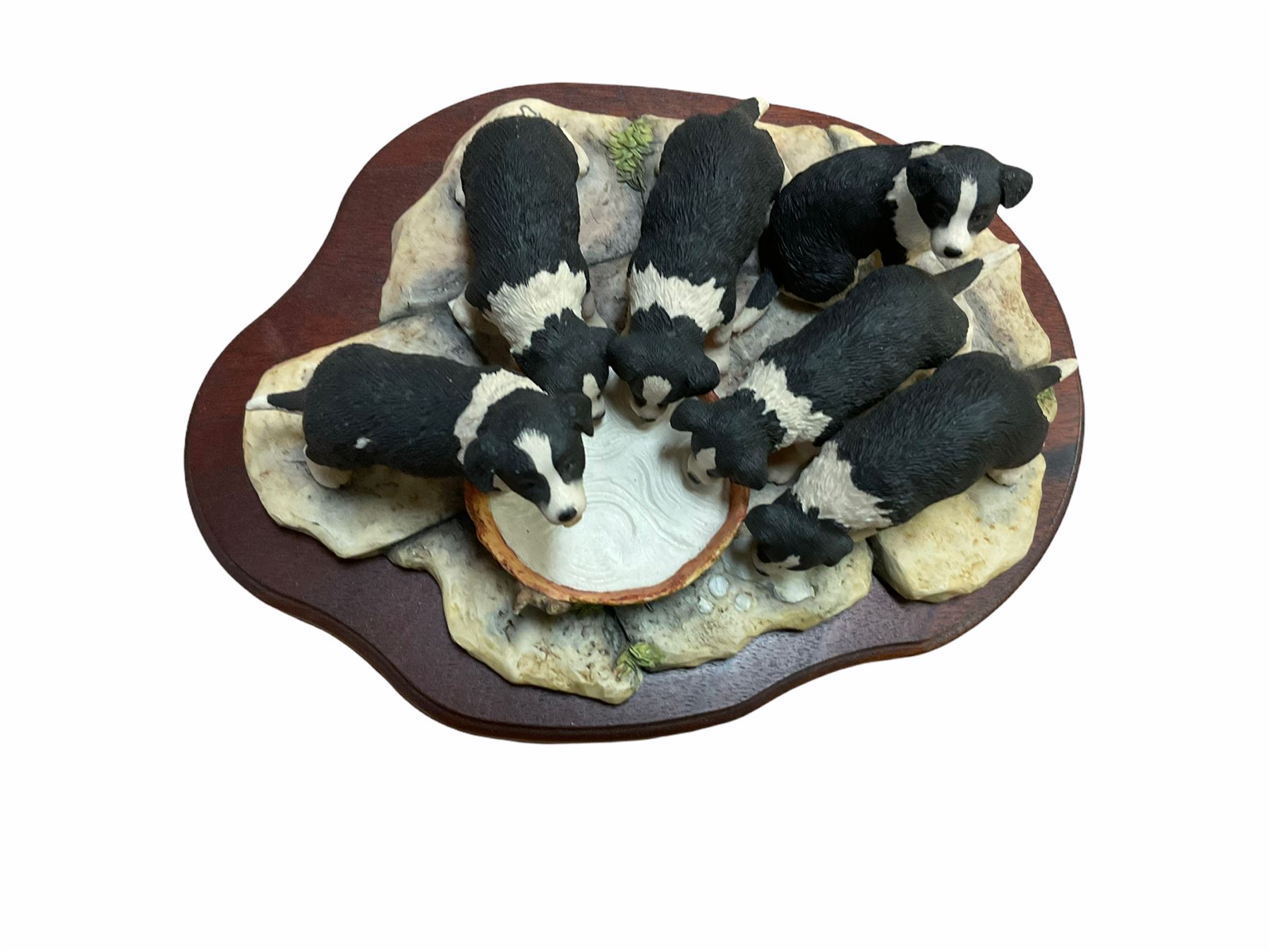 Border fine arts figures, Pick of the litter, model no JH30, by Ray Ayres L26cm, Tug of war, model no JH61, by D Walton H11.5cm and Robin with chicks in boot, model no RB45, by by Ray Ayres H11cm.  