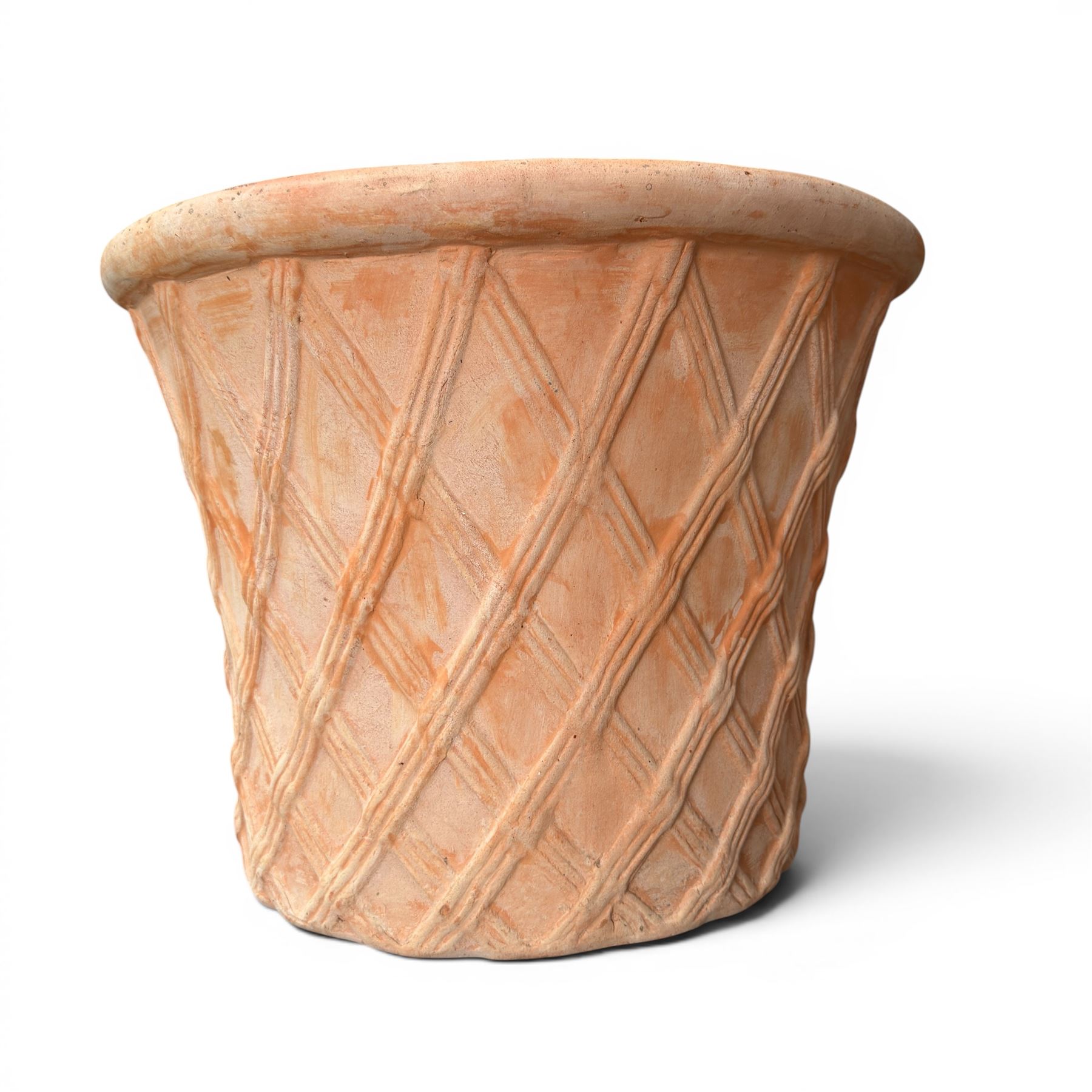 Three terracotta planters with lattice relief and rolled rim