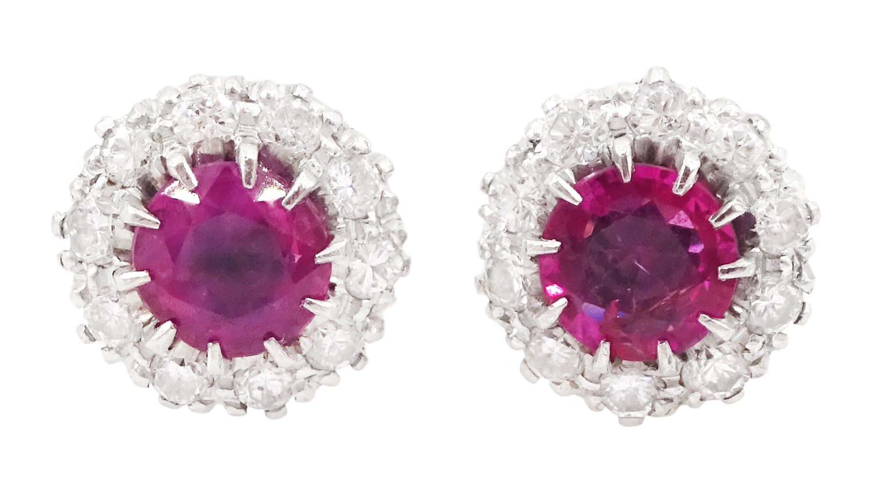 Pair of platinum and white gold round cut ruby and round cut diamond cluster stud earrings, total ruby weight approx 1.35 carat, total diamond weight approx 0.20 carat