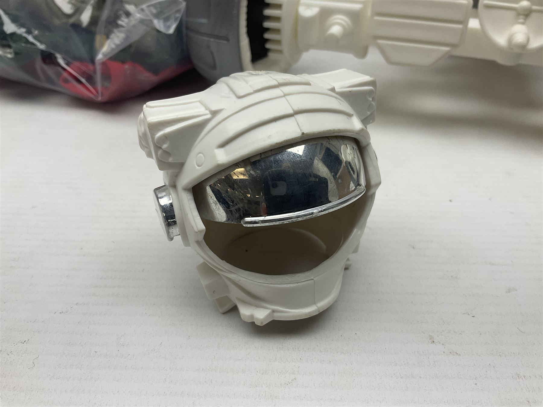 Action Man - large collection of 1960s and later figures and accessories including Spaceman with ATLRV vehicle; two figures marked 'Made in England by Palitoy under licence from Hasbro 1964'; twenty-five assorted weapons; radio backpacks; kit bags; twenty-one pairs of boots; football boots and snow shoes; metal diver's boots and three pairs of flippers; two pairs of jackboots; roller skates; various tunics, trousers, flying suits, jumpers, belts etc; twenty helmets, berets, busby, kepis, submariner etc; and quantity of other accessories