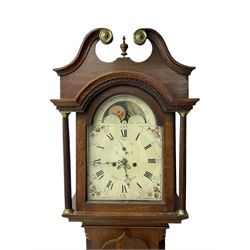 W Sargent of Boston (Lincs) - late 18th century oak cased 8-day longcase clock, with a deep swans necked pediment and brass paterie, break arch hood door with a dog tooth moulding above and detached reeded pilasters with brass capitals, trunk with canted corners and recessed pilasters, long trunk door with a pointed top and central lock escutcheon, on a shortened plinth with applied skirting, painted dial with a moon disc to the arch and spandrels with depictions of fruit within gesso borders, Roman numerals with Arabic five minutes and matching steel hands, date aperture and seconds dial, dial pinned via a false plate to a rack striking movement, striking the hours on a cast bell. With pendulum and weights.