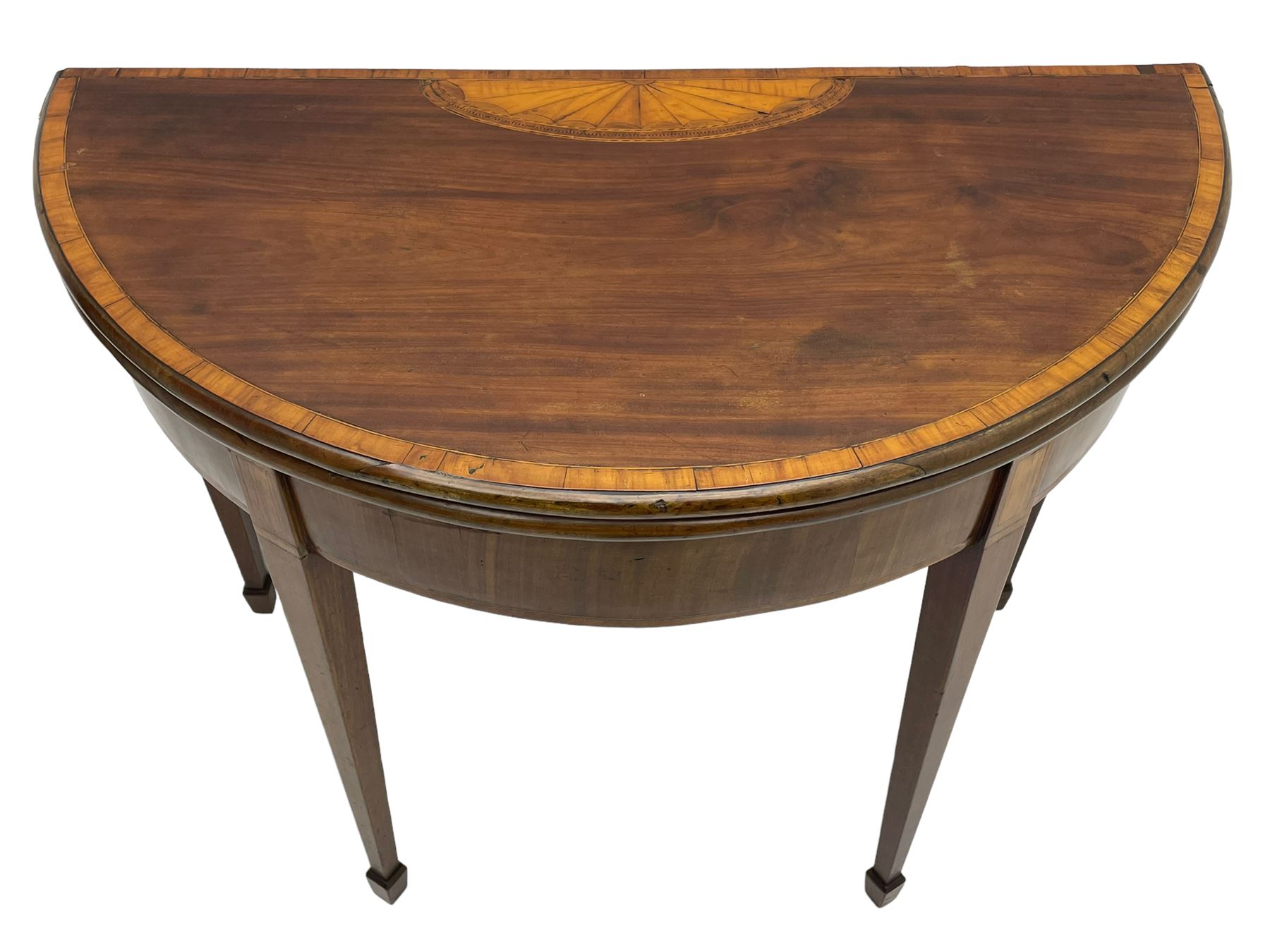 George III inlaid mahogany card table, demi-lune fold-over top with satinwood band and large fan motif, baize lined interior, double gate-leg action base, on square tapering supports with spade feet