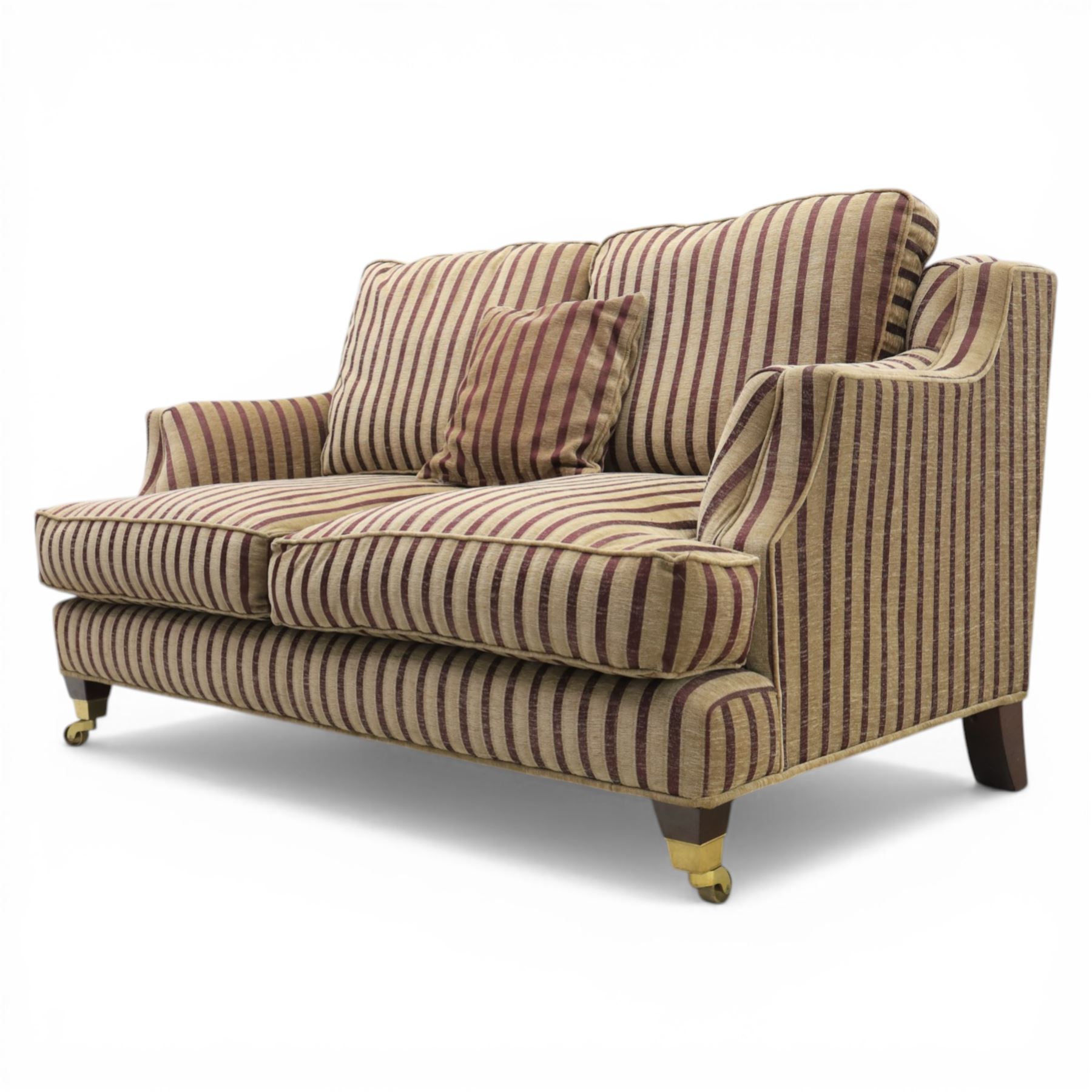 Late 20th century fabric upholstered sofa, with loose back and seat cushions, broad padded arms with piped borders, upholstered in striped textile, raised on concealed feet