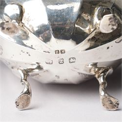 Pair of late Victorian silver salts of oval panel sided design with scroll handles and shaped supports Birmingham 1899 Maker Henry Matthews and two later silver salt spoons 