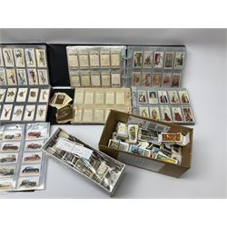 Quantity of cigarette and trade cards including John Player & Sons, Gallaher Ltd, W.A. & A.C. Churchman, housed in ring binder folders and loose together with a few empty vintage cigarette card albums, in two boxes