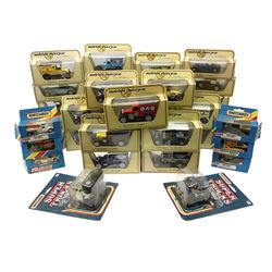 Twenty-nine matchbox Models of Yesteryear including commercial vehicles, trams, sports cars etc; six other Matchbox die-cast models; all boxed; and two Matchbox Super Trucks in opened blister packs (37)