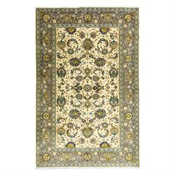 Central Persian Kashan hand-knotted carpet, ivory ground, with an all-over floral design o...