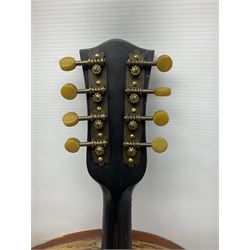 Early 20th century Italian Rafaele Disantino eight-string mandolin with two-piece back and spruce top with stamped Rafaele Disantino signature; bears maker's label L61cm; in wooden carrying case