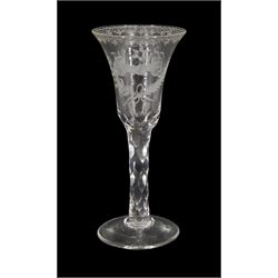 Late 18th century drinking glass, the trumpet bowl engraved with the initials 'TM MJ' and two hands clasped together in a handshake, upon a diamond faceted stem and conical foot, H17cm