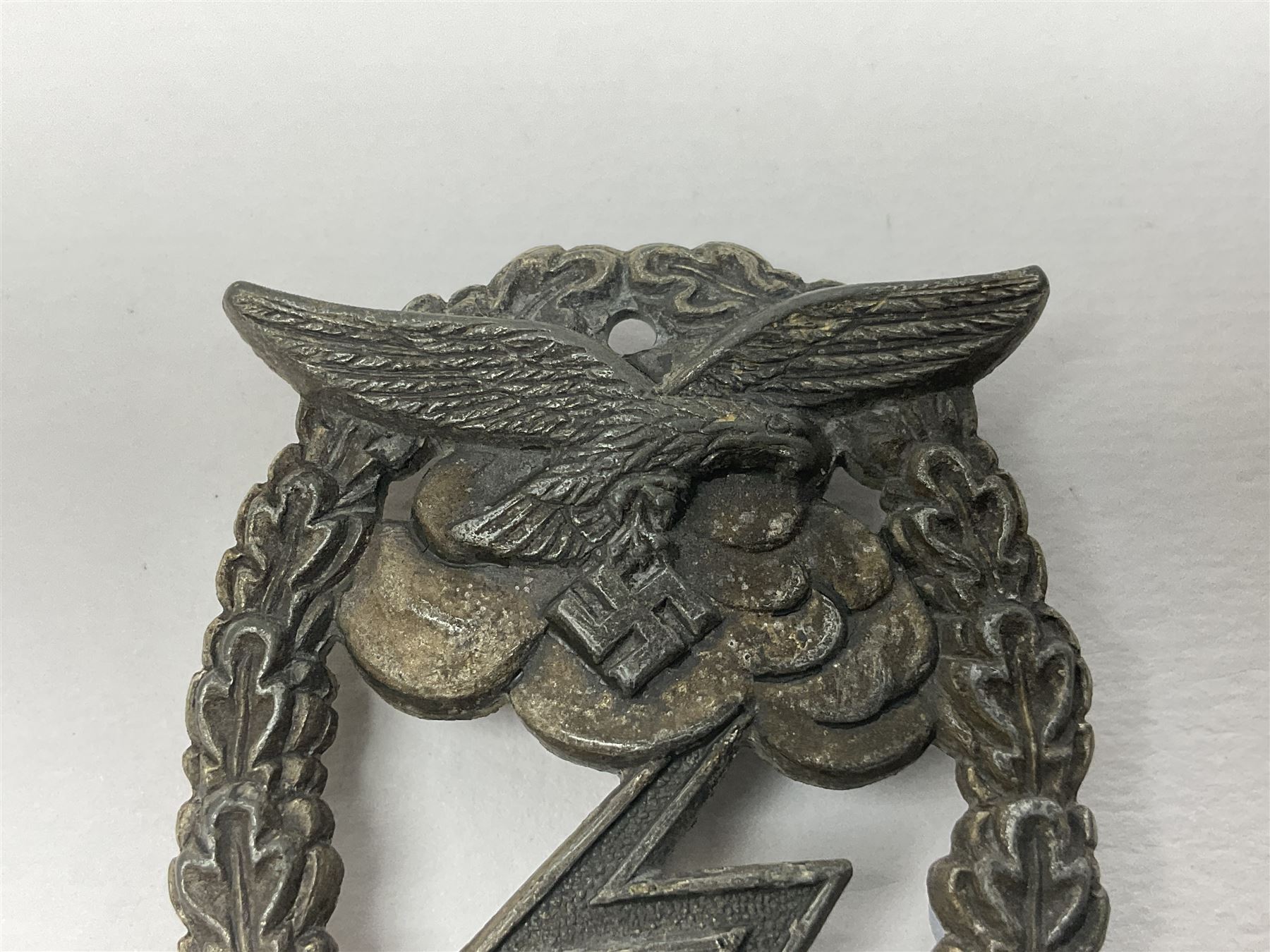 Two WW2 German Luftwaffe Ground Assault/Combat badges - one with flat pin and maker's mark M.u.K.; the other unmarked with round pin (2)