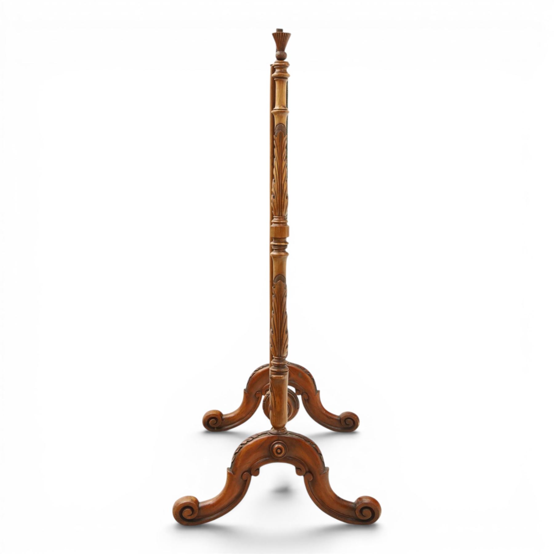 Two Victorian fire screens, comprising mahogany pole screen with glazed floral woolwork panel on turned support and triform base (H 142cm, W 48cm); and a larger carved walnut tapestry fire screen, glazed panel depicting a domestic interior scene, scroll carved cresting, barley twist uprights and turned stretcher base (H 75cm, W 49cm)