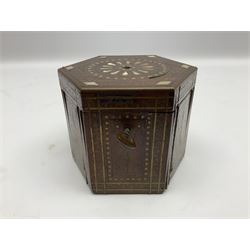19th century Persian rosewood tea caddy, of hexagonal form, the sides strung and inlaid with brass wire to form panels of flowering urns and flower heads within scalloped borders, the hinged cover similarly strung and inlaid with brass, copper and mother of pearl in the form of a flower head and lozenge border, surrounding an inner circular banded motif, opening to reveal a red stained interior, H9.5cm D12cm