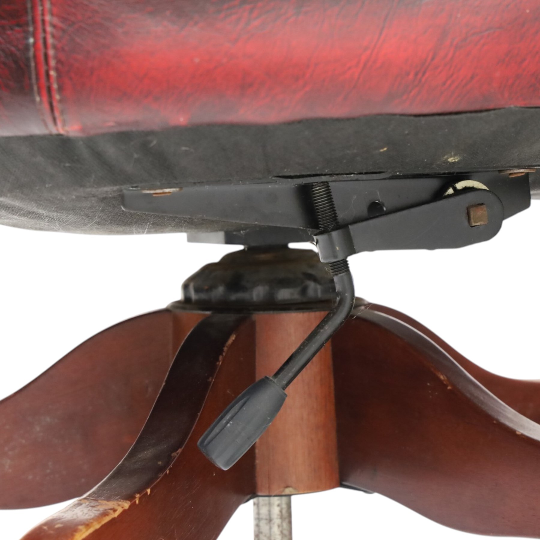 Georgian design captains swivel desk chair, rolled cresting rail over open spindle back on swivel action, upholstered in buttoned oxblood leather