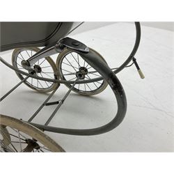 Silver Cross coach-built doll's pram with green fold-down hood and cover, sprung tubular frame, chrome and white handle, four spoked wheels with brake, mattress, pillow and bedding L97cm