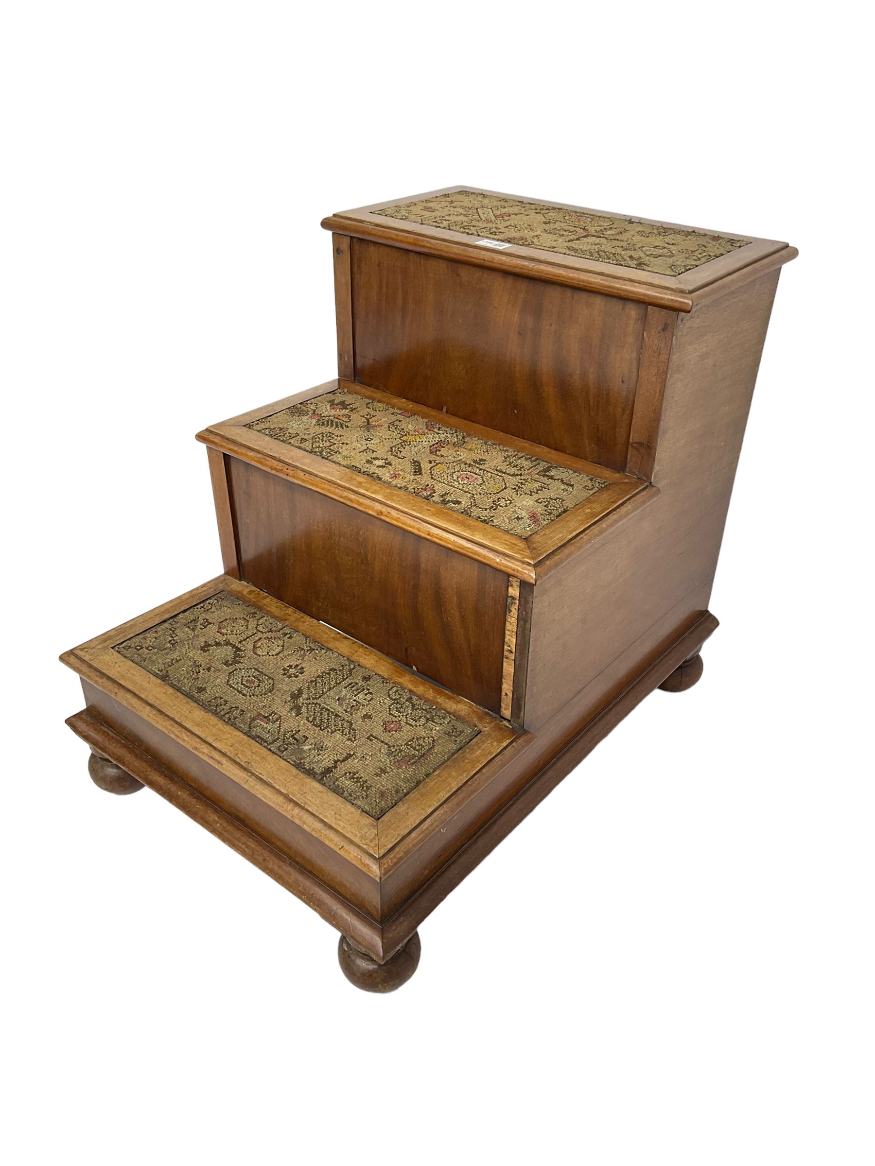 19th century mahogany step commode, pull-out action to reveal commode, the top with hinged lid, on turned feet