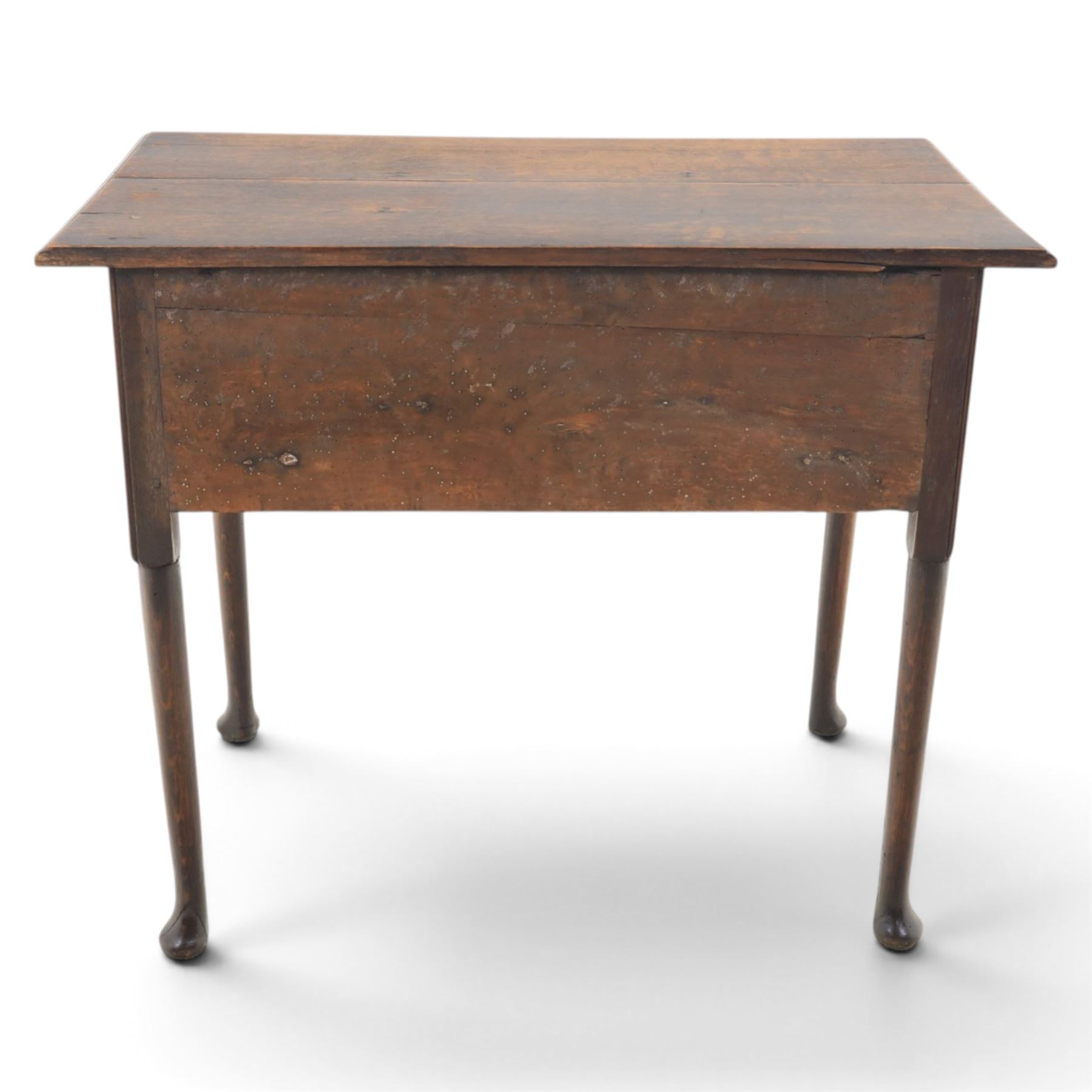 18th century oak lowboy, rectangular plank top with moulded edge, above three assorted drawers with brass swan neck handles, shaped apron raised on pad feet