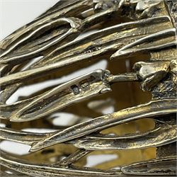 Modern silver limited edition Easter egg, no. 70/500, the gilt openwork body decorated with cascading bluebells and hinged cover with pierced circular panel set with a single faceted purple stone, opening to reveal a gilt interior, upon silver stand with three scrolling pad feet, each hallmarked St James House Company, London 1981, height including stand 8cm