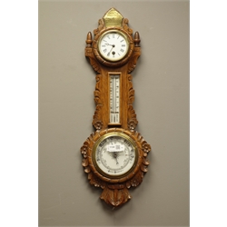  Early 20th century oak aneroid barometer with enamel dial clock and mercury thermometer, carved with scrolls, flower head and a ships anchor, brass inscribed presentation plaque 'Mr. Charles Harris... York 1911' (H64cm), and a small Art Deco period mantle clock  