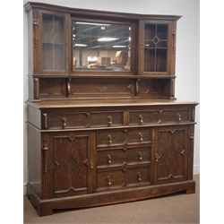  Early 20th century oak raised mirror back sideboard, projecting cornice, two glazed cupboards flanking a bevel edged mirror, five drawers, two cupboards, W170cm, H206cm, D60cm  